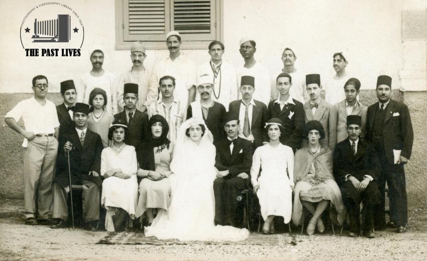 A group photo of family members at a wedding in 1952.