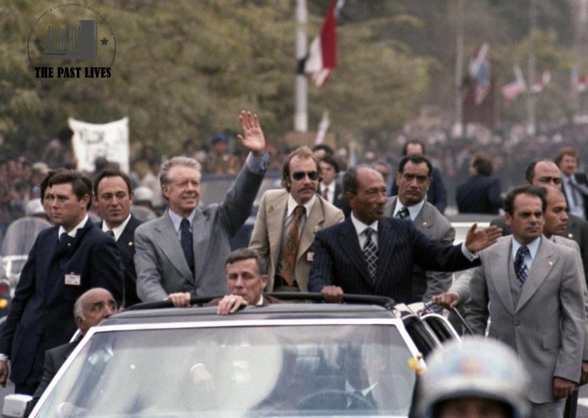 Carter and Sadat ride in a motorcade through Cairo, 1979