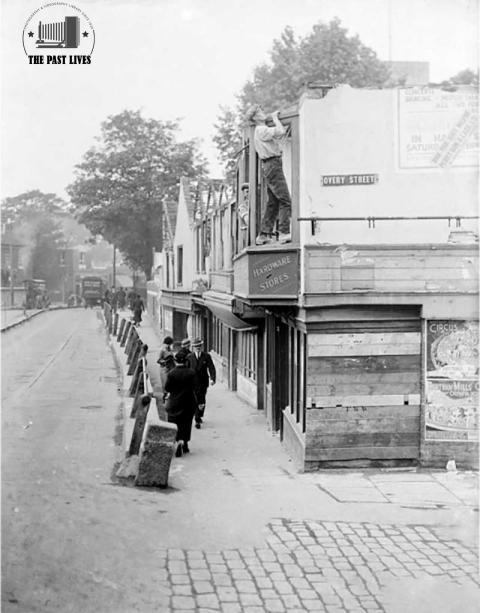 An old building being pulled United Kingdom 1936